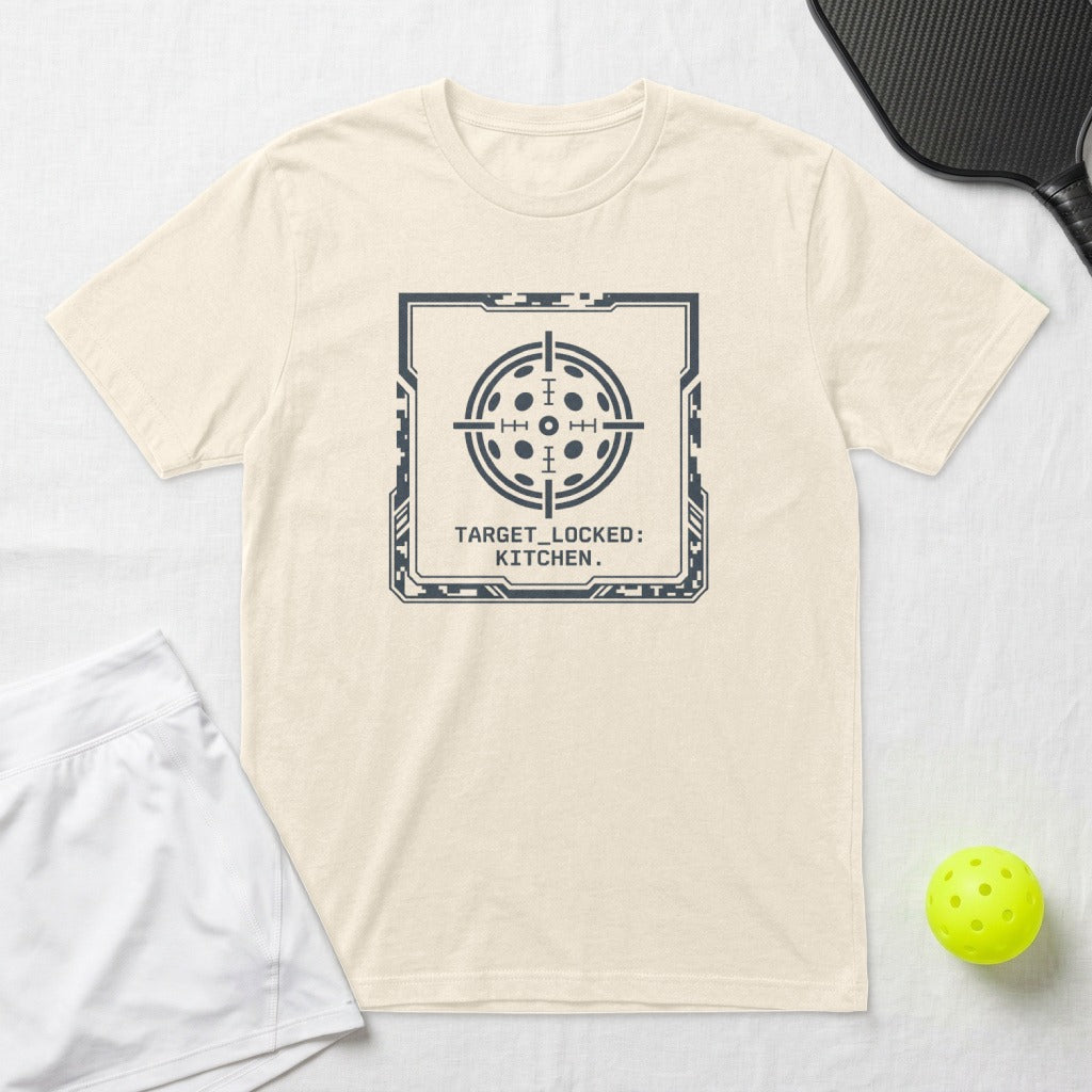 Cream t-shirt with a dark grey square target design and text "TARGET_LOCKED: KITCHEN."