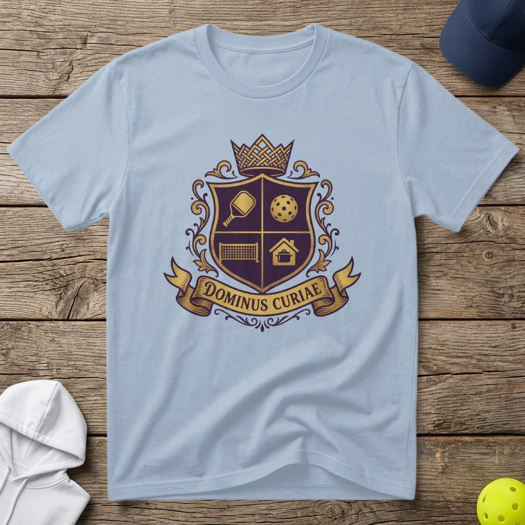 Light blue t-shirt with a crest featuring pickleball and house icons.
