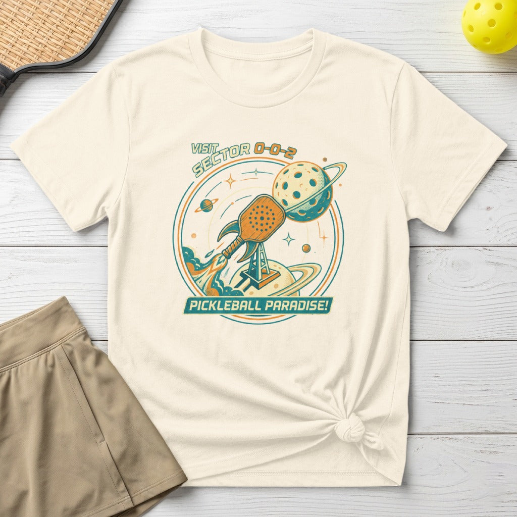 T-shirt with "Visit Sector 0-0-2 Pickleball Paradise" text and pickleball rocket graphic.