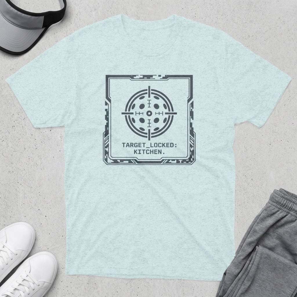 Light blue t-shirt with a circular target graphic and text "TARGET_LOCKED: KITCHEN."