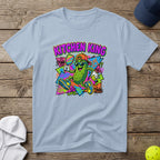 Cartoon pickle character wearing sunglasses and a hat, holding a pickleball paddle.