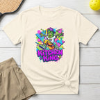 T-shirt with cartoon character and "KITCHEN KING" text on a cream shirt.