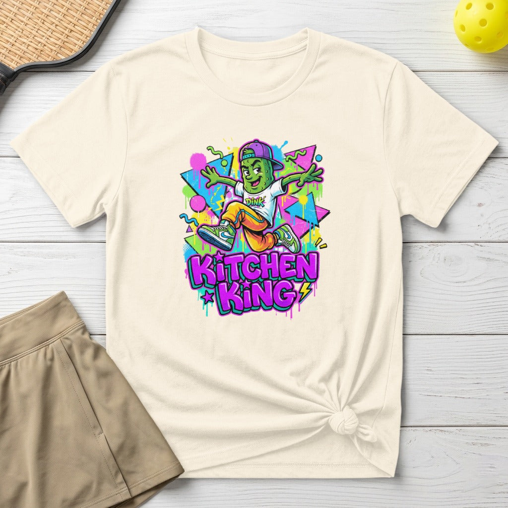 T-shirt with cartoon character and "KITCHEN KING" text on a cream shirt.