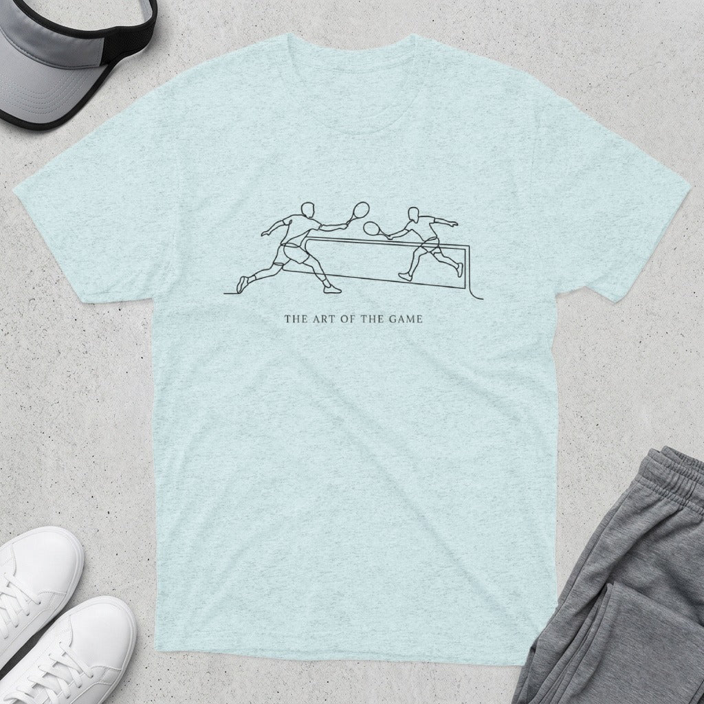 Light blue t-shirt with minimalist line art of tennis players and text "THE ART OF THE GAME".