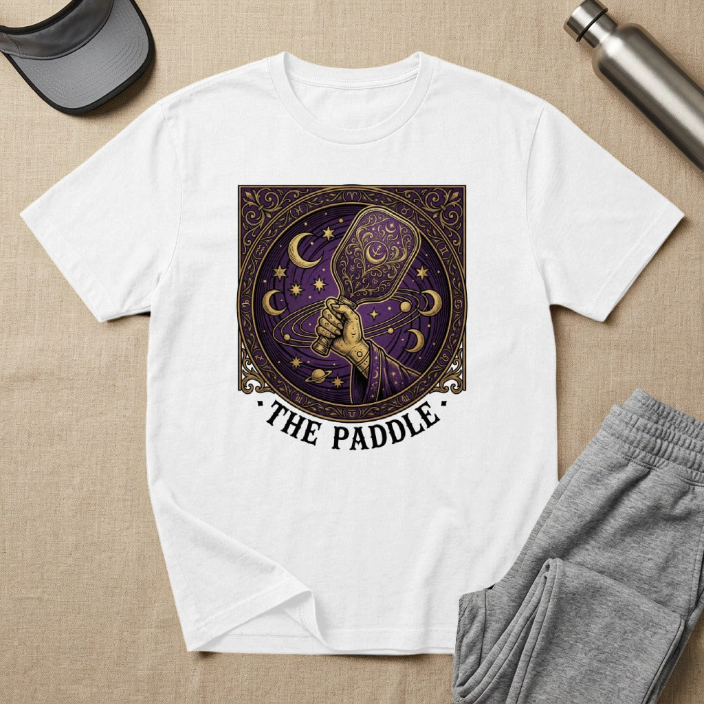 White t-shirt with celestial paddle graphic and "The Paddle" text.