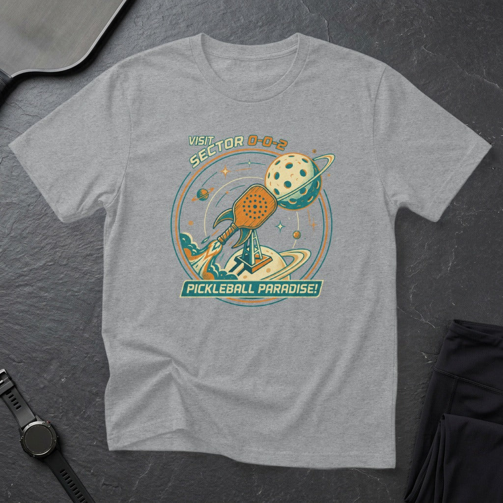 Grey t-shirt with pickleball and planet graphic.