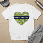 White t-shirt with heart-shaped pickleballs and text "Love at First Dink".