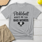 Grey t-shirt with "Pickleball Makes Me Say Bad Words" text and paddles.