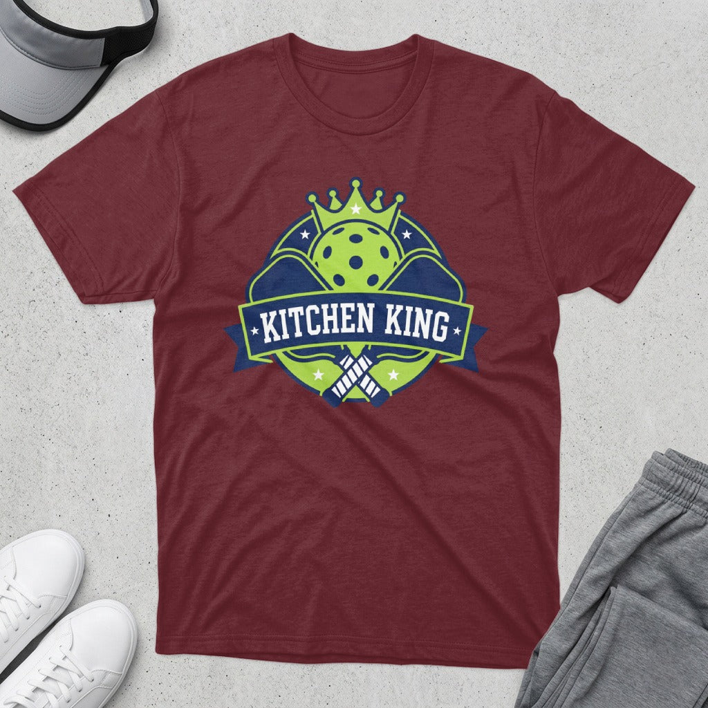Maroon t-shirt with "Kitchen King" logo featuring a crown and pickleball paddles.