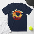 Navy t-shirt with "Pickleball & Chill" text and sunset graphic.