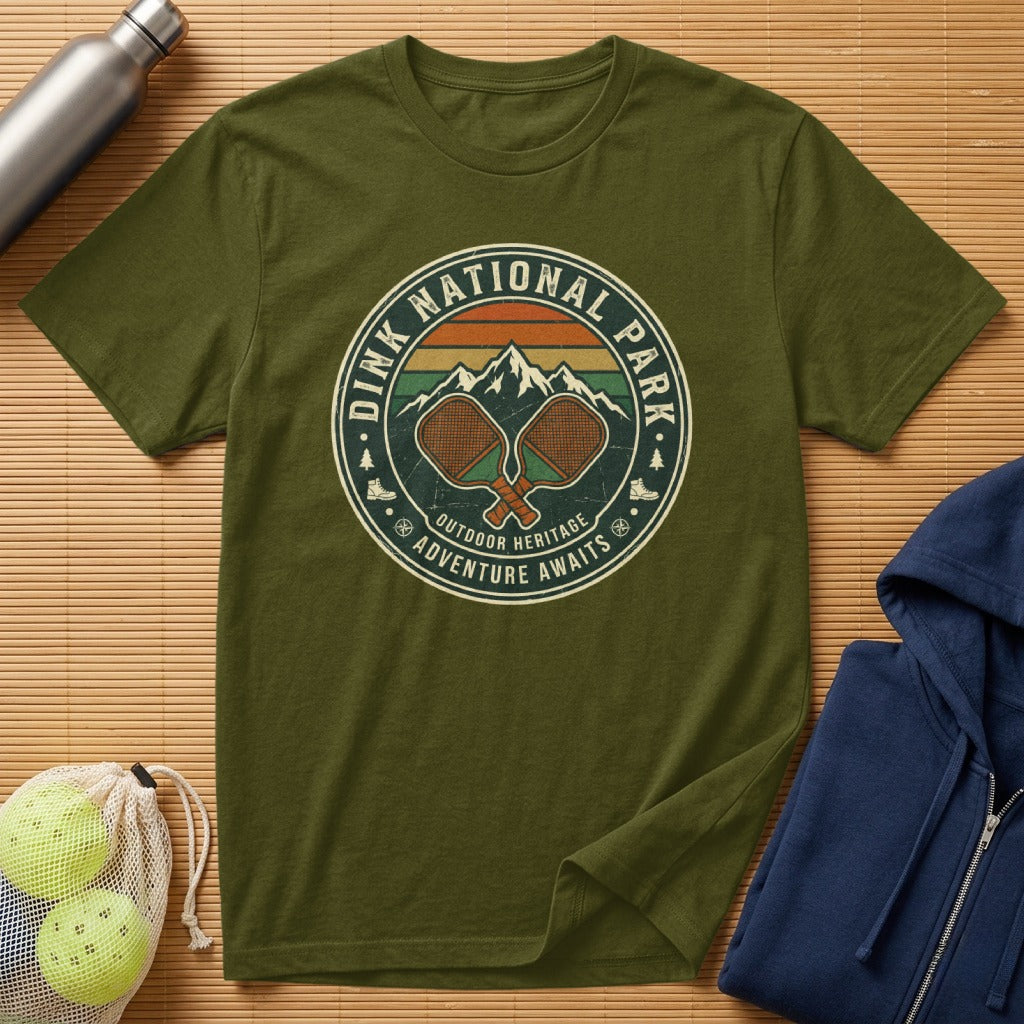 Olive green t-shirt with "Dink National Park Outdoor Heritage Adventure Awaits" logo.