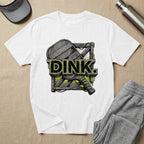 White t-shirt with "DINK." text and pickleball paddle graphic.