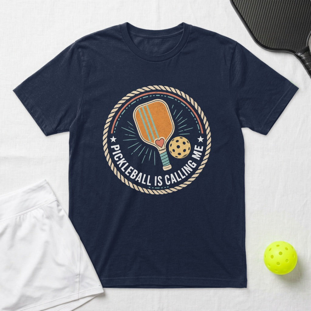 Navy t-shirt with circular pickleball graphic and text "PICKLEBALL IS CALLING ME".